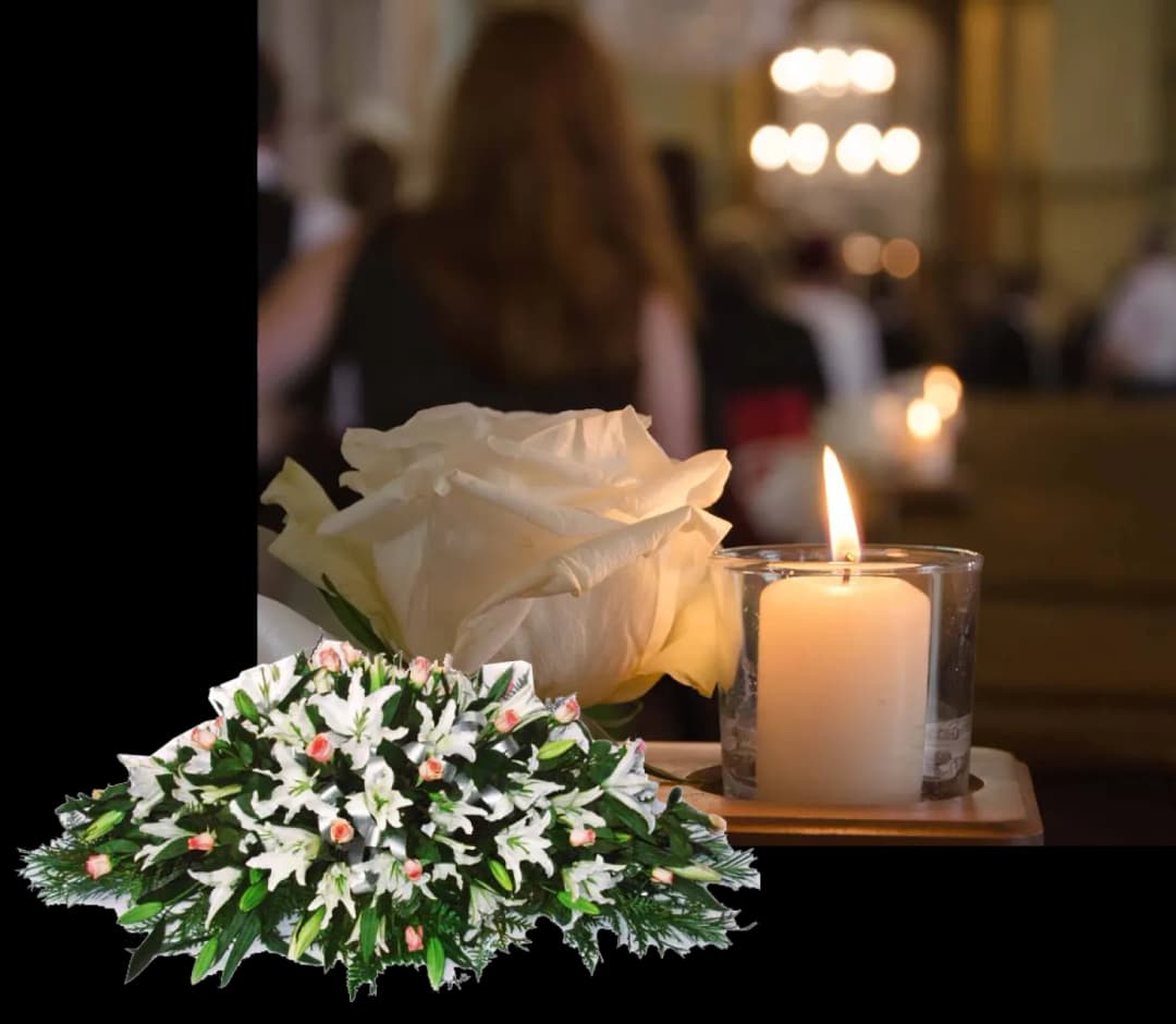 Amarillo funeral home service close up of candle and white rose